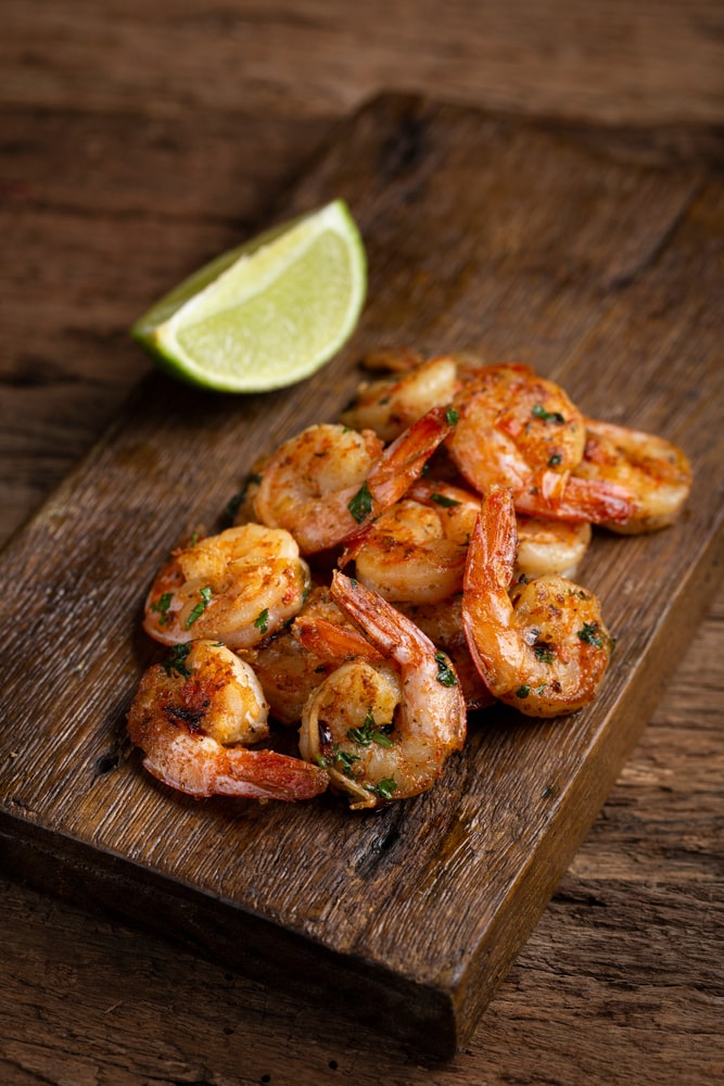 Easy Cajun Shrimp Served With Lemon Wedges