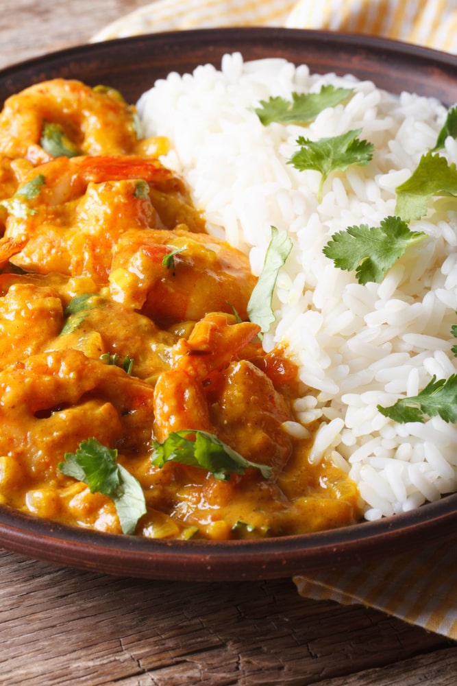 coconut shrimp curry served with steamed rice