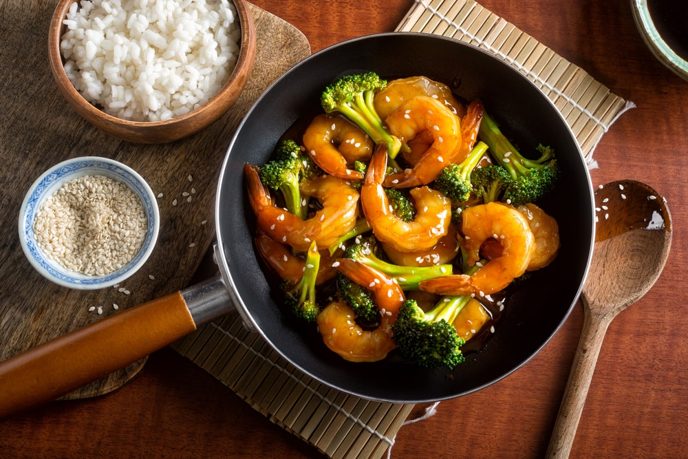 a pan of shrimp and broccoli