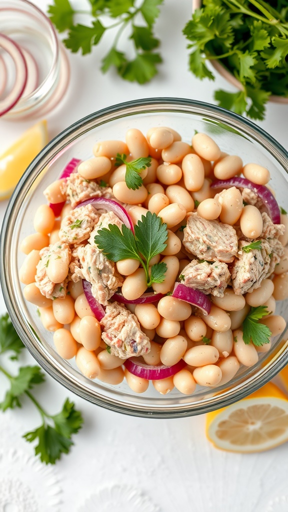 A bowl of Tuna and White Bean Salad with lemon slices and fresh herbs